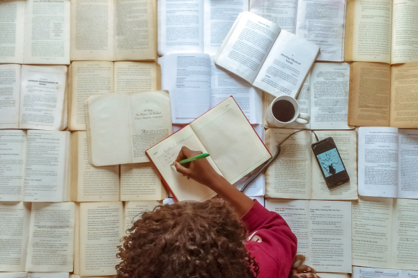 A Back-to-School State of Mind CANVA Reading Books and taking notes