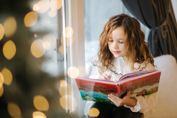 Holiday Writing for Childrens Writers CANVA girl reading